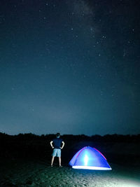 Man standing at night
