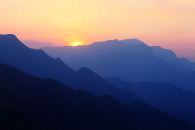 Scenic view of mountains at sunset