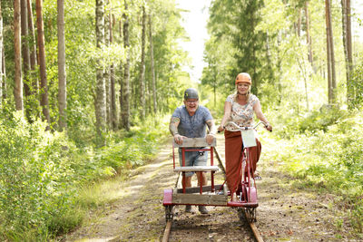 Couple riding handcar