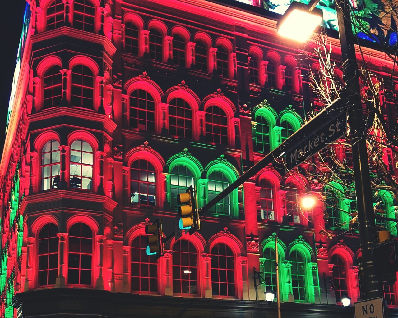 LOW ANGLE VIEW OF ILLUMINATED BUILDING