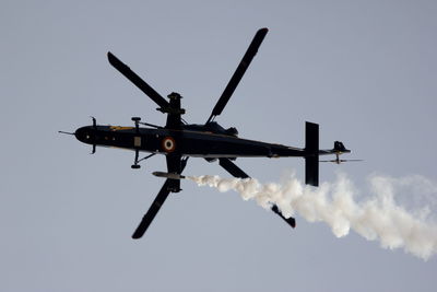 Low angle view of airplane flying in sky