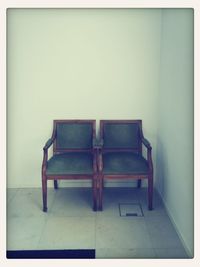 Empty chairs against the wall