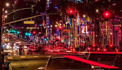 Illuminated city street at night