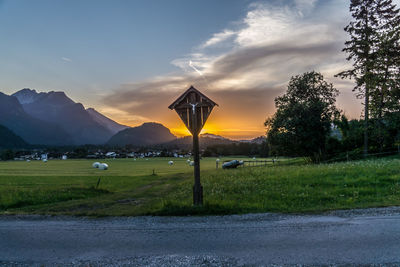 Scenic view of field against sky during sunset