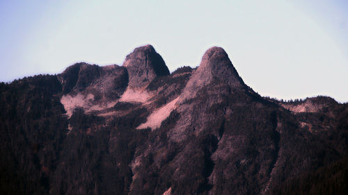 Low angle view of rock formation against sky