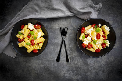 High angle view of chopped fruits in bowl on table