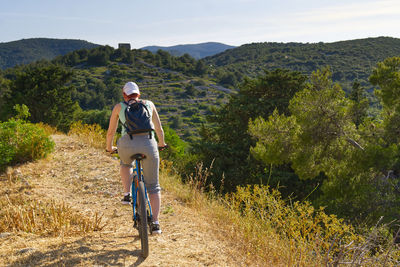 Man riding bicycle on mountain