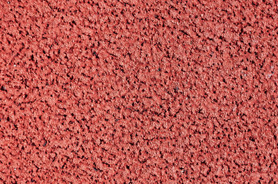 Full frame shot of red textured wall