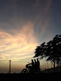 Silhouette of trees against sky at sunset