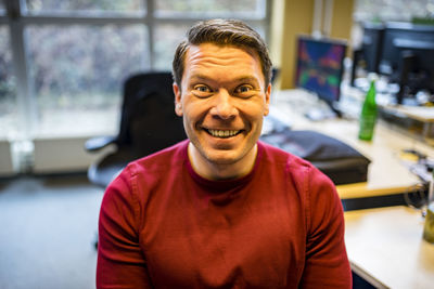 Portrait of happy man at office