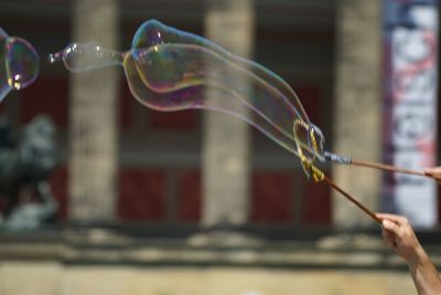 Person holding bubbles