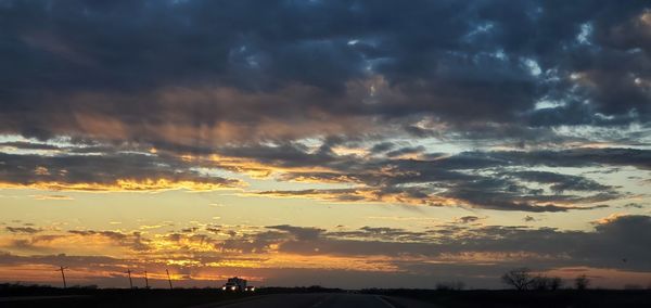 Scenic view of dramatic sky during sunset