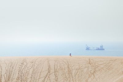 Scenic view of beach against clear sky