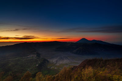 Scenic view of mountain against sky during sunset