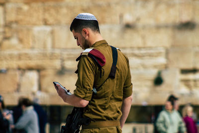 Side view of man standing outdoors