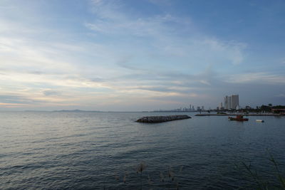 Scenic view of sea against cloudy sky