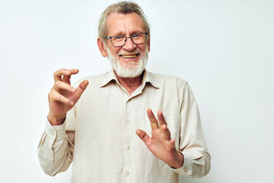 Portrait of man gesturing against white background