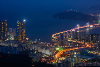 High angle view of illuminated buildings in city at night