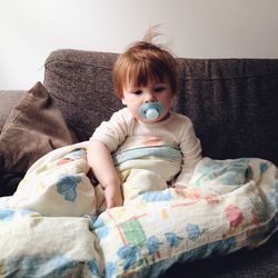 Portrait of cute baby sleeping on bed