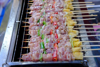 High angle view of meat on barbecue grill