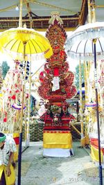 Statue outside temple against building