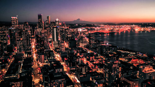 Aerial view of illuminated city buildings