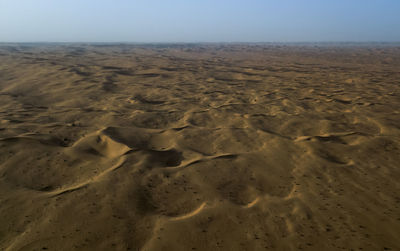 Scenic view of desert against clear sky