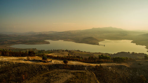 Scenic view of landscape against sky during sunset