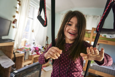 Portrait of smiling young woman at home