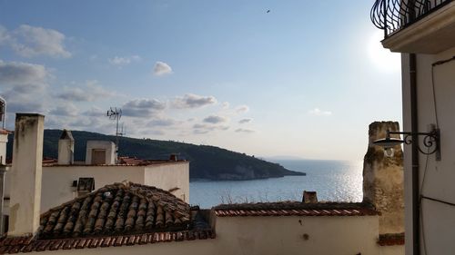 View of rooftops by the sea