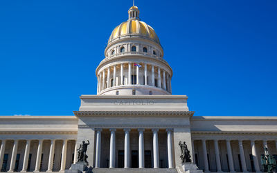 Low angle view of building against blue sky