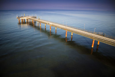 Pier over sea against sky