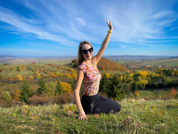 Full length of woman standing on field