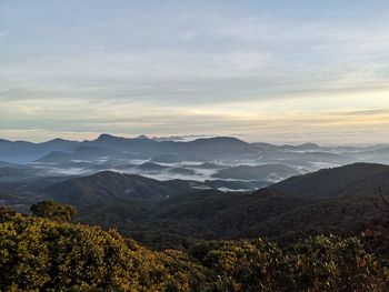 Scenic view of mountains against sky at sunset