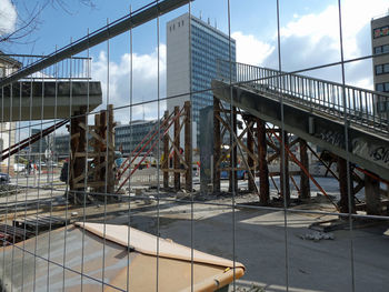 Bridge in city against sky