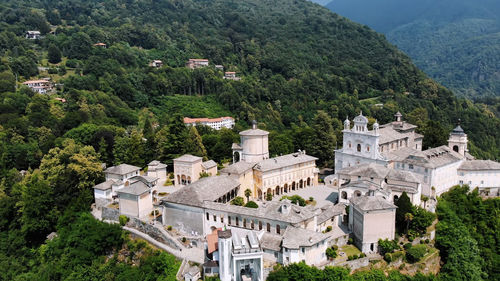 Aero view of beautiful shrine, ancient temple complex, big castle, sanctuary located in mountains 