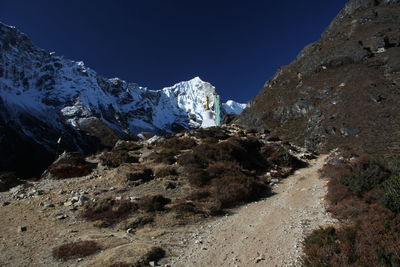 Scenic view of snowcapped mountains against clear sky