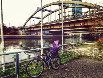 Bicycle leaning on bridge