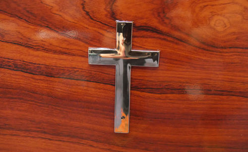 High angle view of cross on table