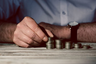 Close-up of hands on table