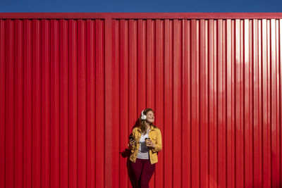 Full length of a smiling young woman