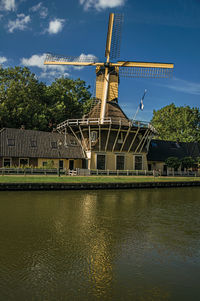 Traditional windmill against sky