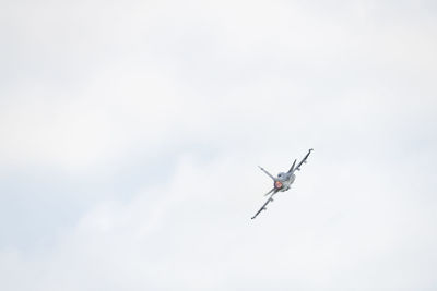 Low angle view of airplane flying in sky