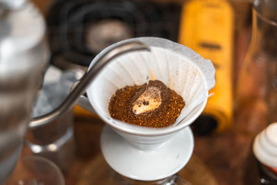 High angle view of coffee in cup on table