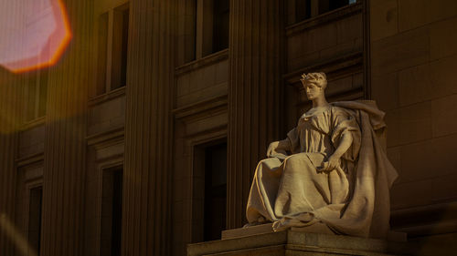 Low angle view of statue of historic building