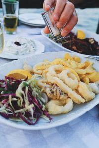 Close-up of person preparing food on table