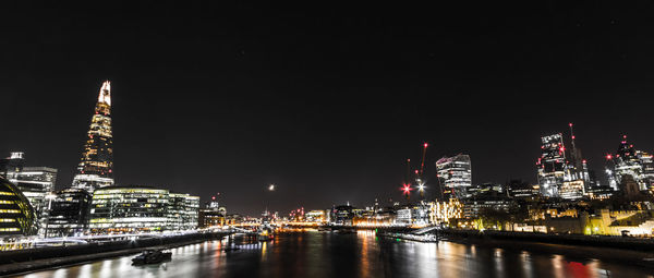 Illuminated london city waterfront at night