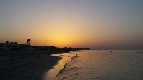 Scenic view of beach during sunset