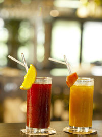 Close-up of drinks in glasses on table