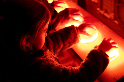 Portrait of woman with red fire